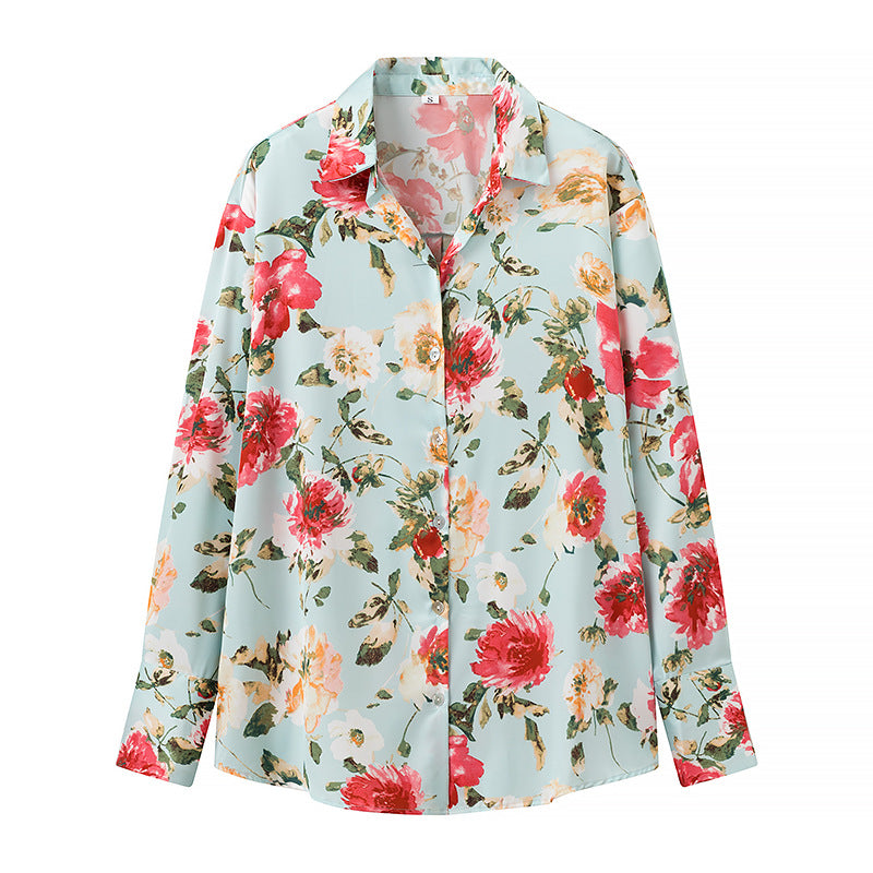 Damebluse med blomsterprint og elegant knapliste Stilla