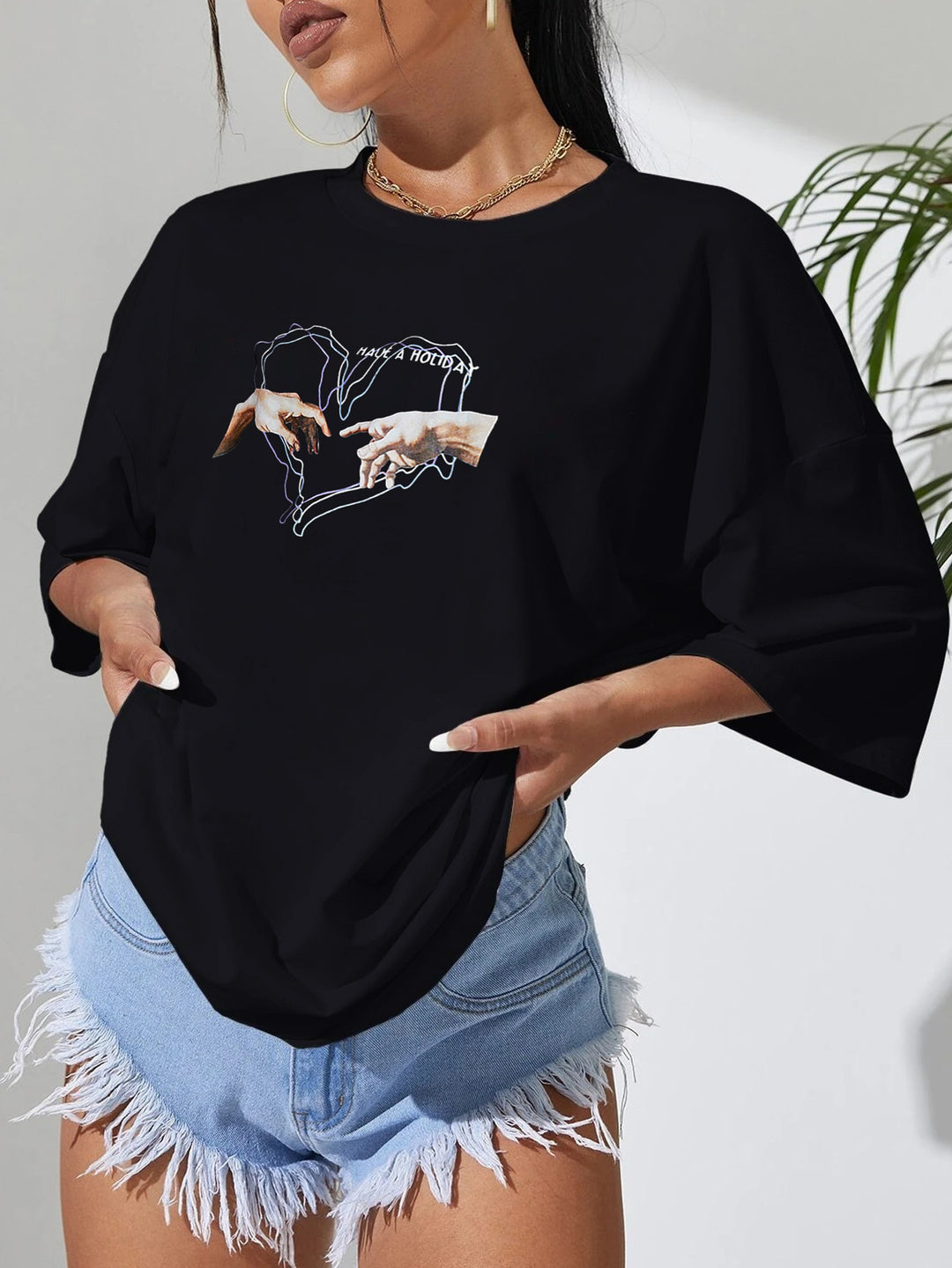 Dame afslappet T-shirt med kreativ håndmotiv og oversized snit Stilla