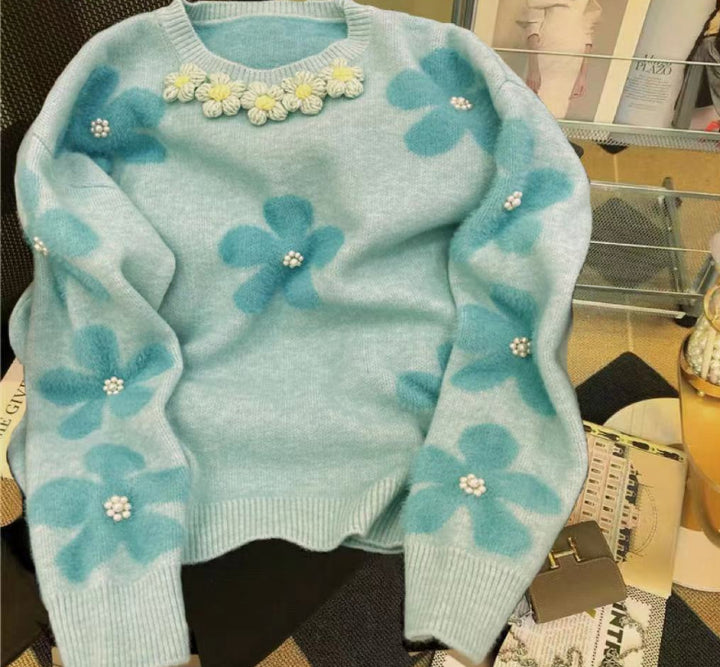 Kvinder strikket trøje med blomsterapplikationer og perledetaljer Stilla