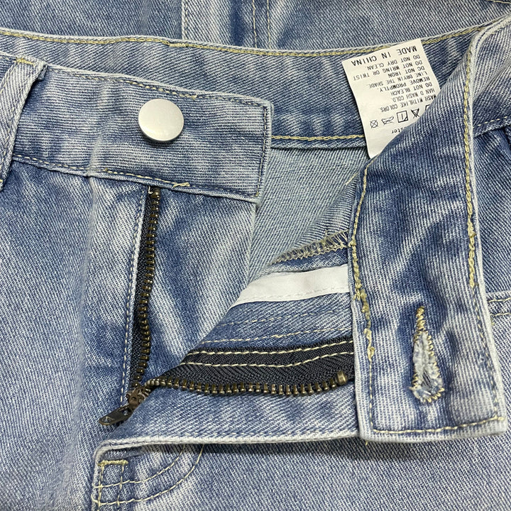 Dame jeansnederdel i vintage-look med asymmetrisk kant og diskrete detaljeringer Stilla