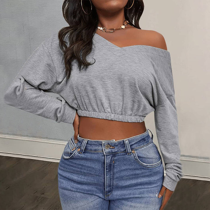 Kvindernes afslappede crop top med off-shoulder design og tætsiddende kant Stilla