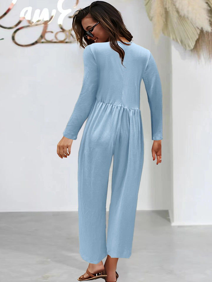 Dame mode jumpsuit med glitrende overdel og vidt skåret ben Stilla
