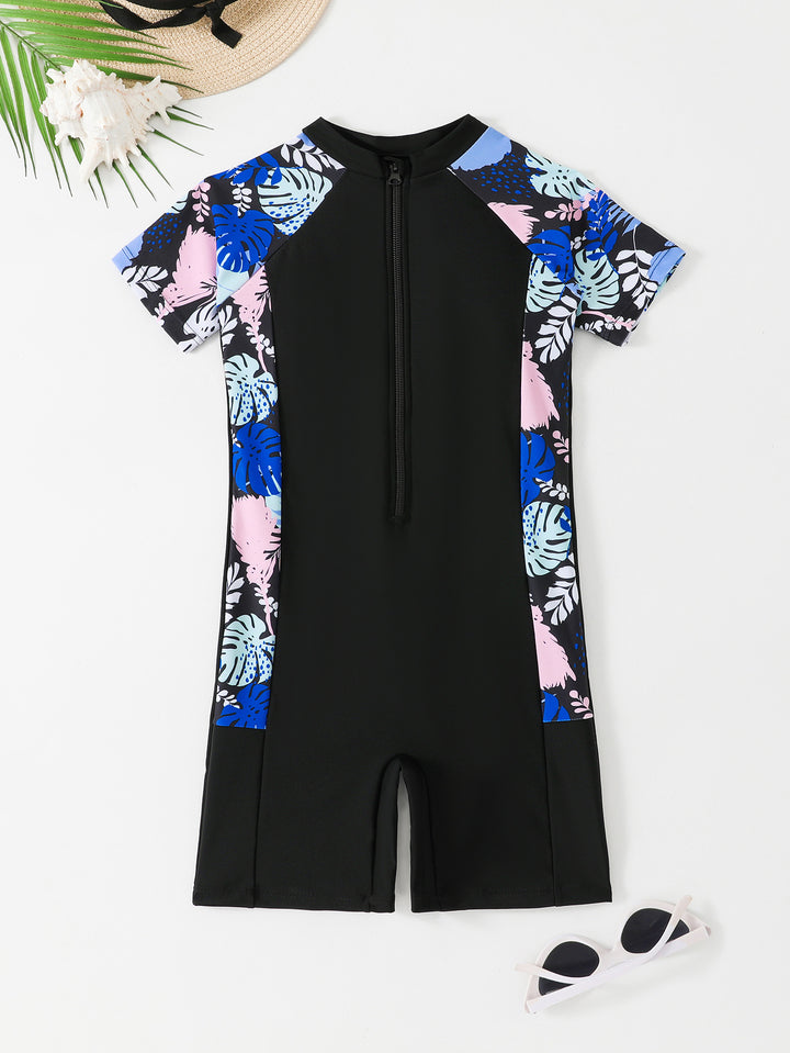 Dame én-delt surfdragt med blomsterdesign og kort snit Stilla