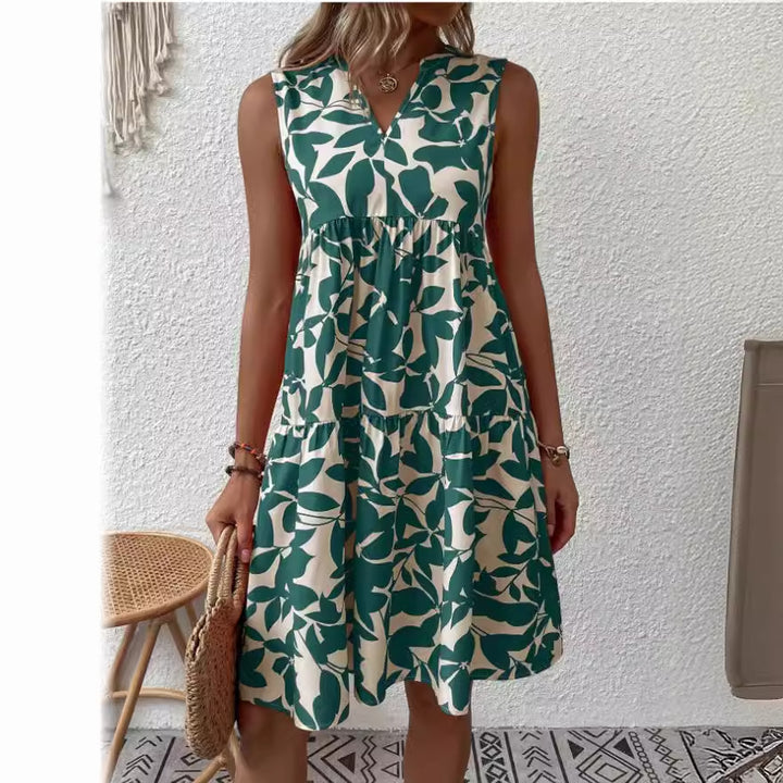 Damekollektion maxikjole med flæse og blomsterdesign Stilla