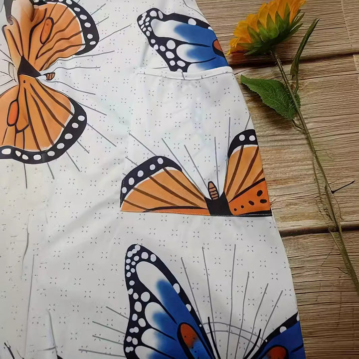 Dame jumpsuit med iøjnefaldende sommerfugledesign og praktiske lommer Stilla