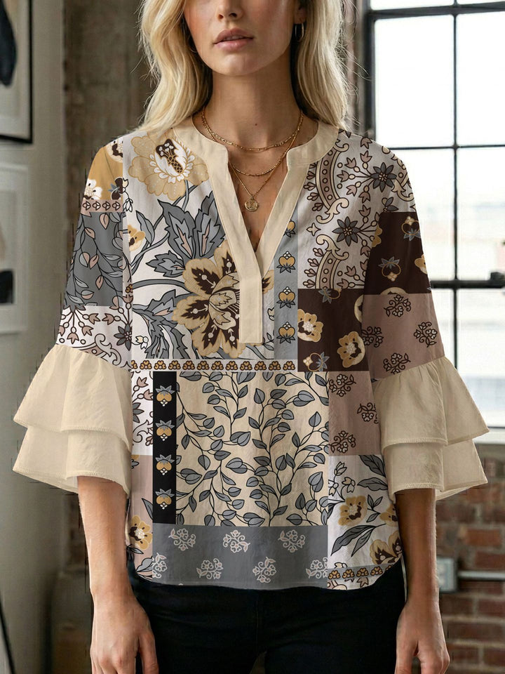 Dame bluse med voluminøse ærmer og kreativt trykdesign Skovae