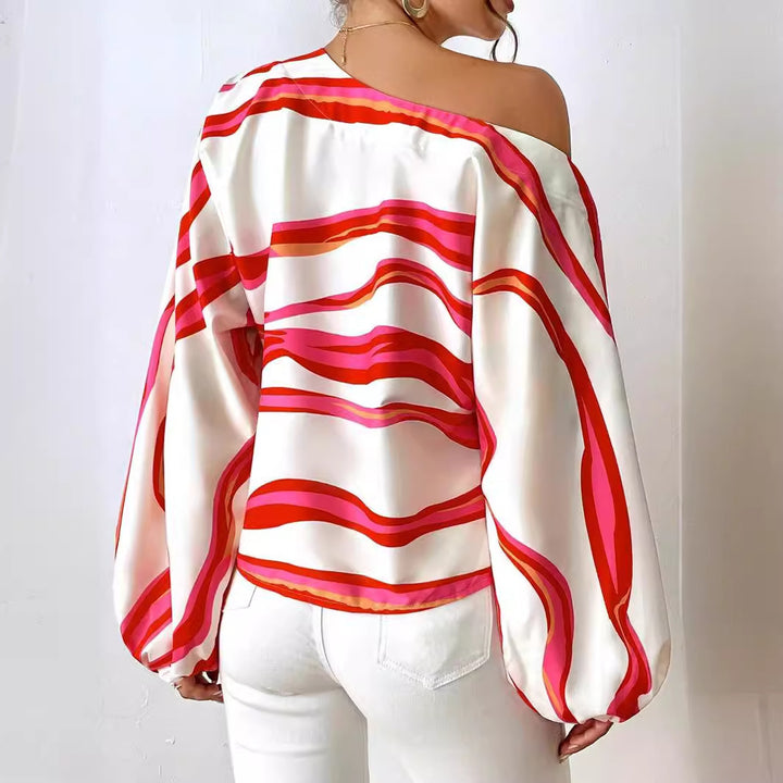 Dame Off-Shoulder-bluse med voluminøse ærmer og moderne stribemønster Stilla