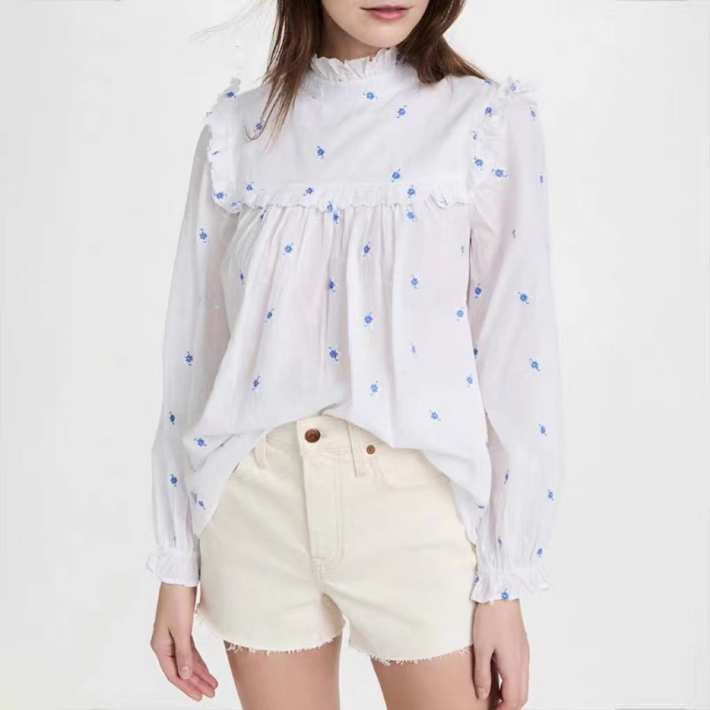 Dame blouse med voluminøse flæsedetaljer og florale broderier Stilla