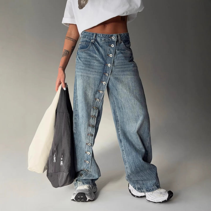 Kvinders bredskårne jeans med en continuér knapstolpe Stilla