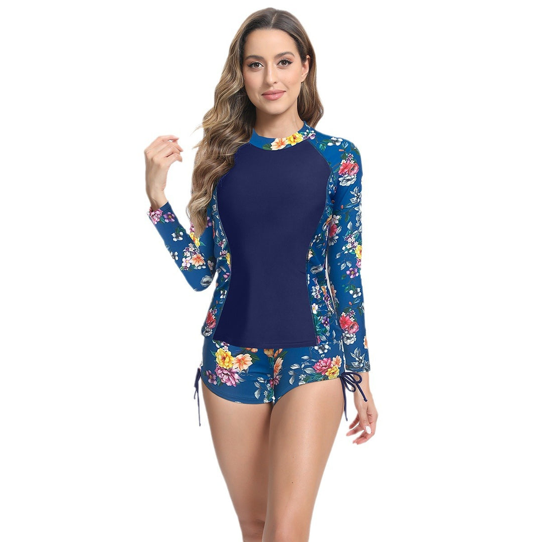 Dame UV-skygge Surf-outfit med blomsterdesign og korte shorts Stilla
