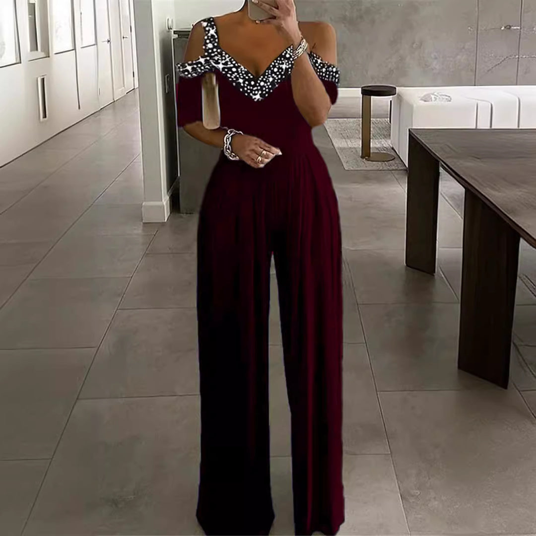 Dame Elegante Jumpsuit med Off-Shoulder Design og Glitteraccenter Stilla