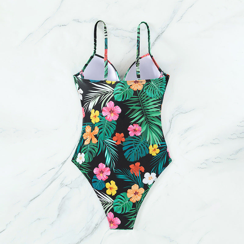 Dame højtaljeret badedragt med blomsterdesign og asymmetrisk detalje Stilla