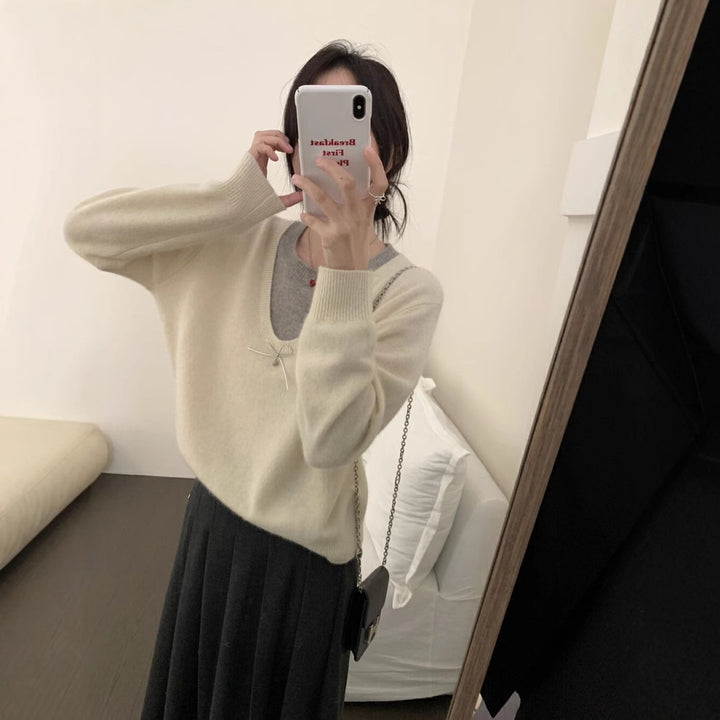 Kvindesweater med elegant V-hals og premium bueapplikation Stilla
