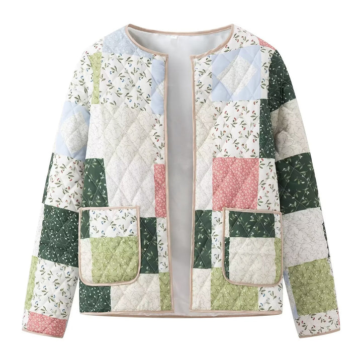 Dame quiltet patchworkjakke med blomstret design og praktiske lommer Stilla