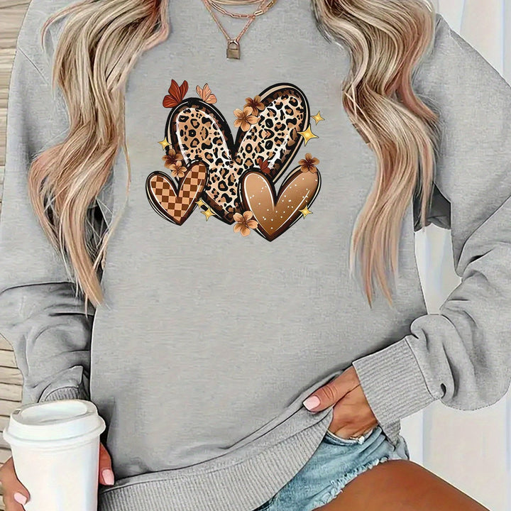 Kvinders sweatshirt med attraktive hjerte motiv.