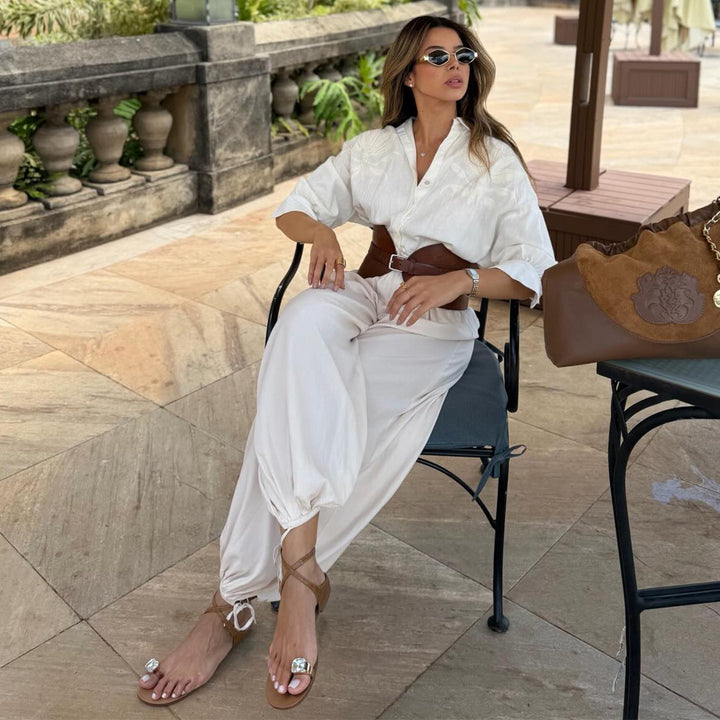Kvindernes voluminøse jumpsuit med elegant knapbluse og taljebælte Skovae