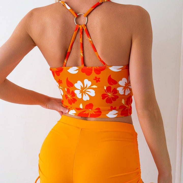 Dame badetop med blomsterdesign og højt skårne shorts Skovae