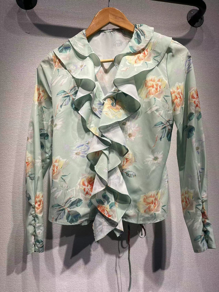Dame ruffles blouse med floral design og elegante detaljer Stilla