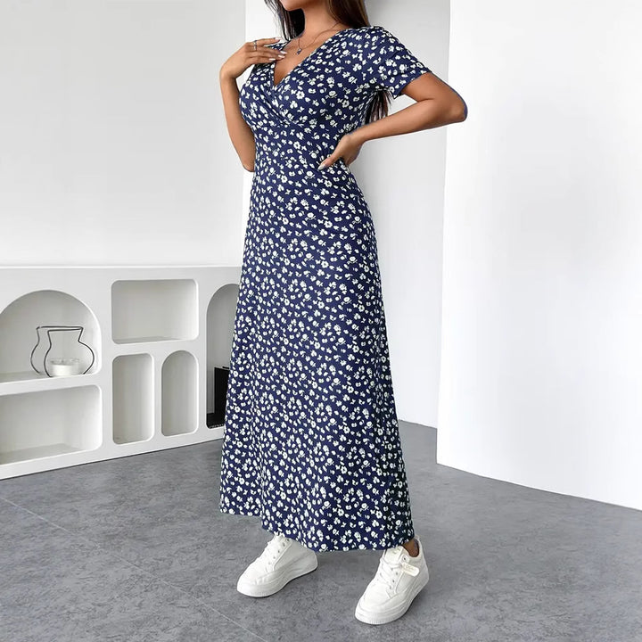 Dame Maxikjole med floral indpakningsdesign og praktiske sidelommer Stilla