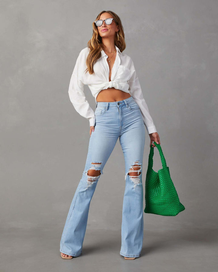 Kvinde bell jeans med trendy slidte detaljer og høj talje Skovae