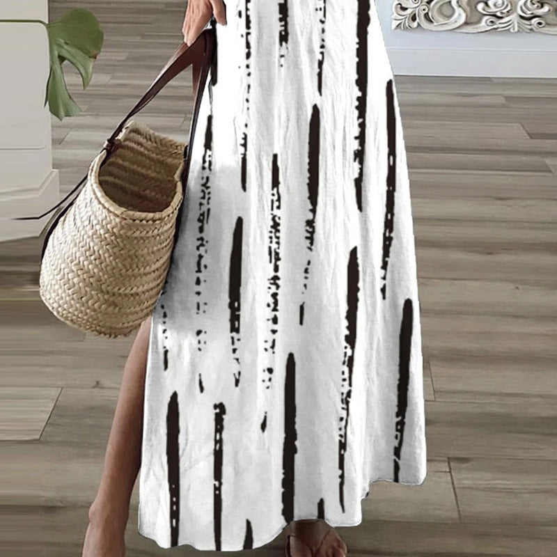 Dame Maxikjole med dyb V-udskæring og sidelængde Stilla