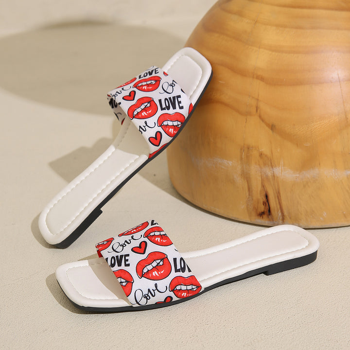Dame slide-sandaler med trendy kys-motiv og behagelig sål Stilla