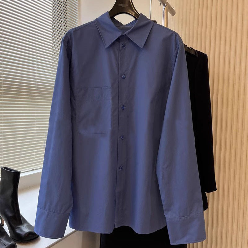 Kvinders elegante langærmede bluse med knaplukning og brystlomme Stilla