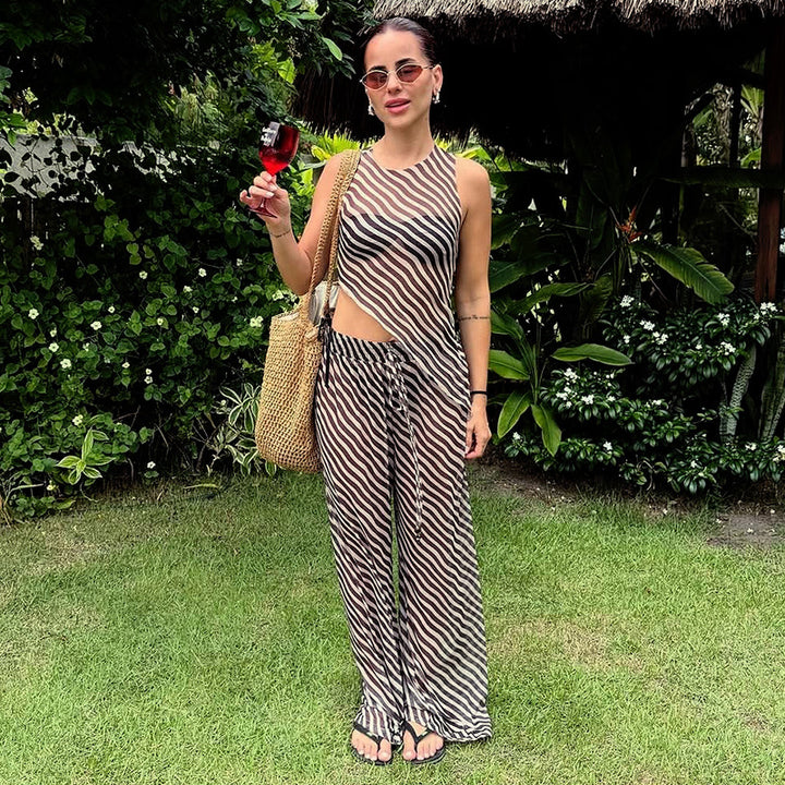 Dame stilfuld jumpsuit med asymmetrisk snit og stribemønster Stilla
