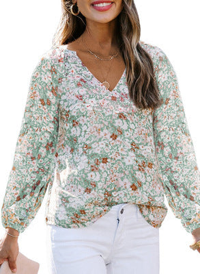 Damebluse med blomster mønstre og vidde ballonærmer Stilla