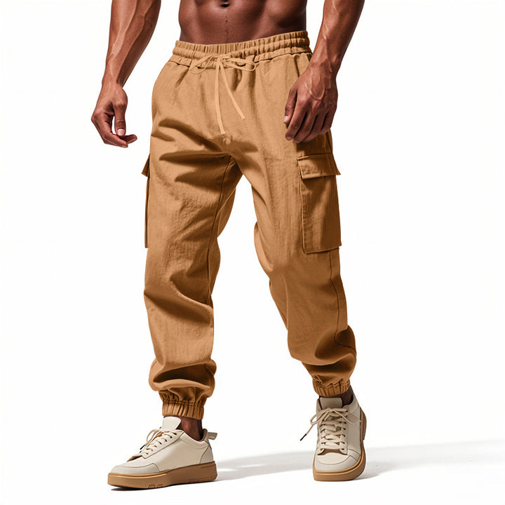 Herrer nan konisk skrånende joggere i utilitarisk stil med elastisk talje, snøre og klaplommer Skovae