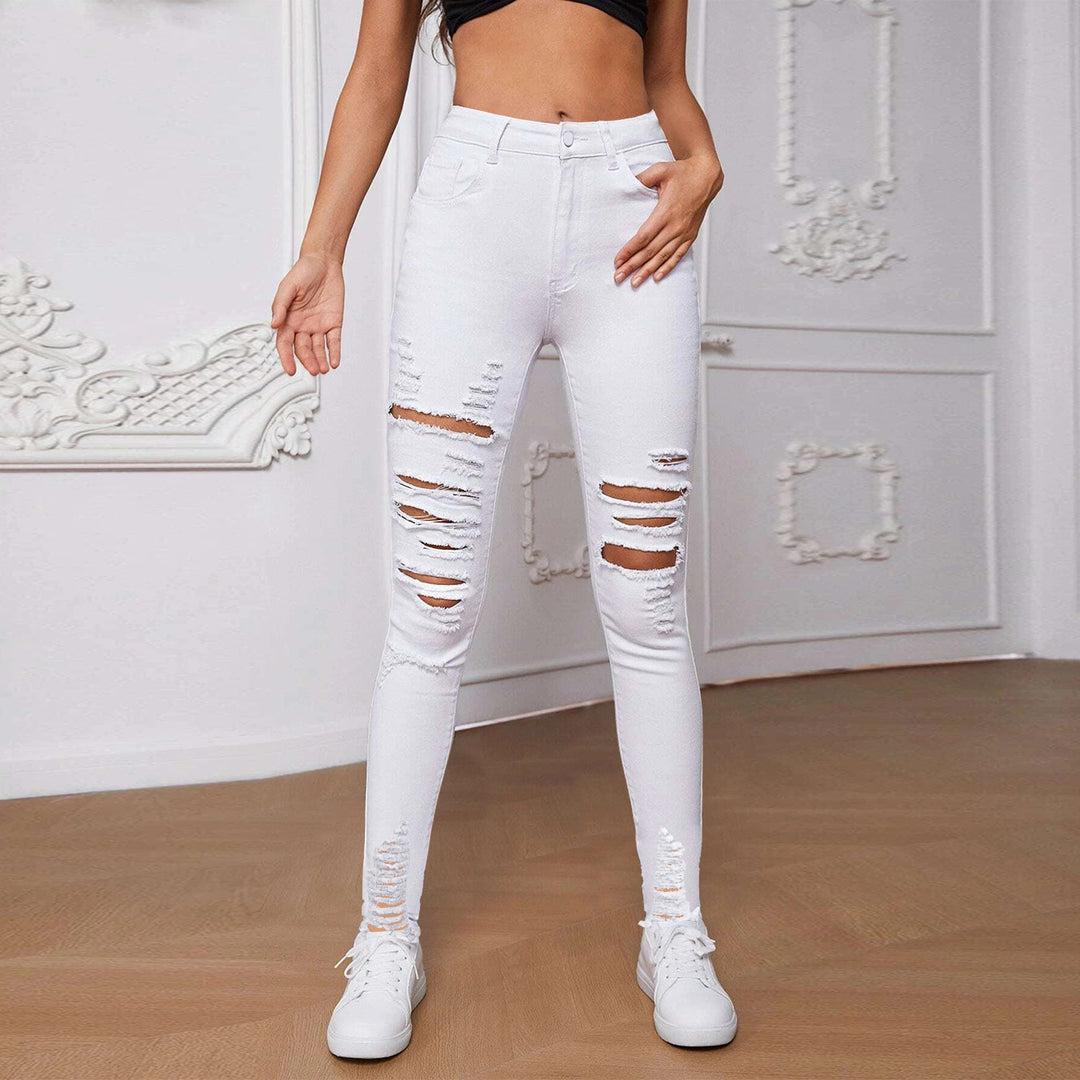 Dame højt skårne skinny jeans med trendy riv detaljer og figurskabende design Stilla