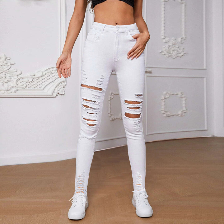 Dame højt skårne skinny jeans med trendy riv detaljer og figurskabende design Stilla