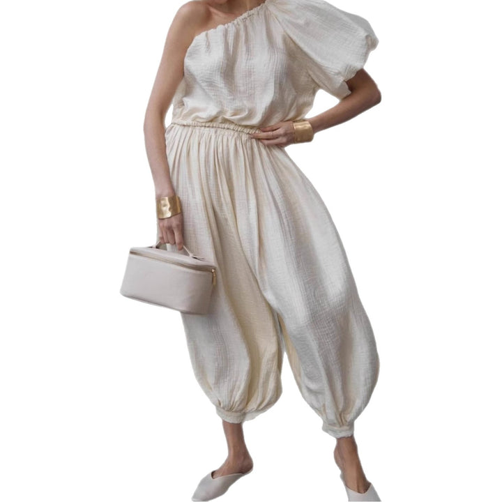 Dame Oversized Jumpsuit med asymmetrisk snit og luftige detaljer Stilla
