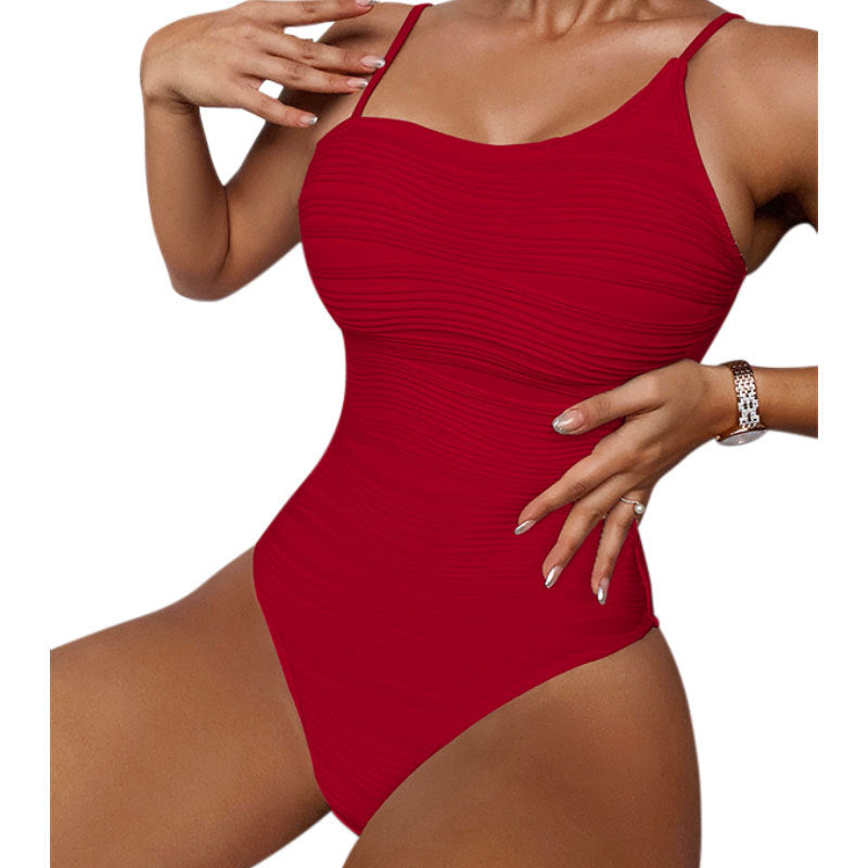 Dame én-delt badedragt med elegant ribdesign Skovae