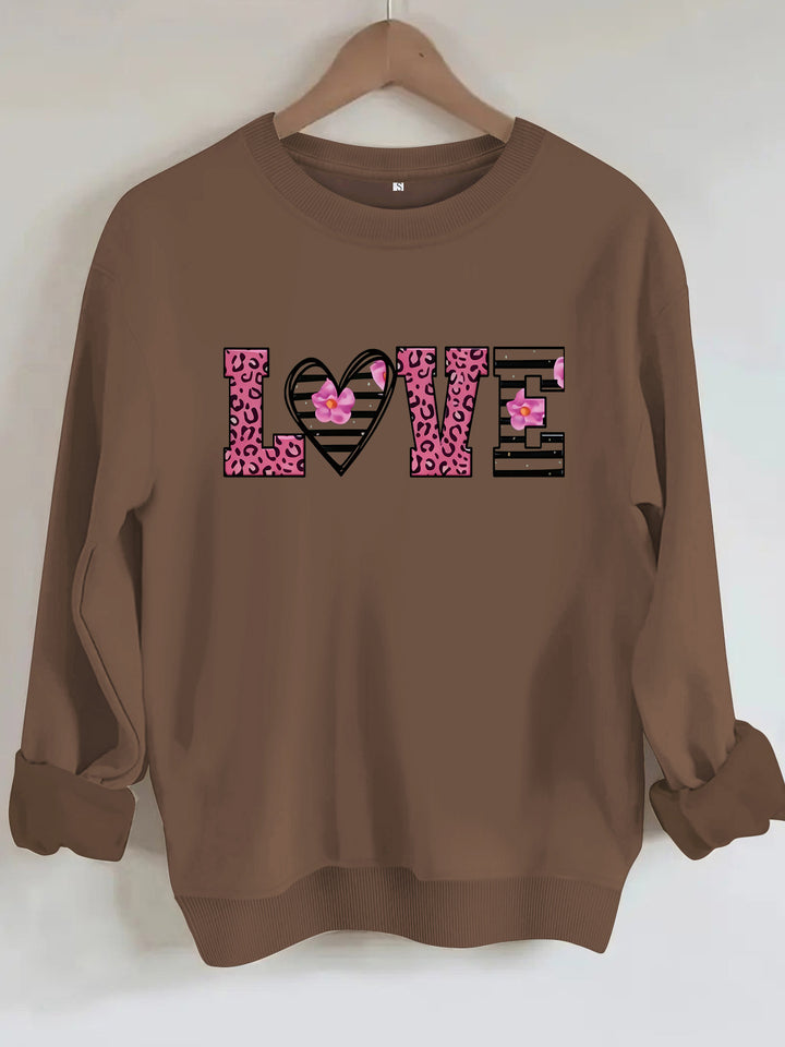 Kvinders sweatshirt med moderne leopard hjerte design og behagelig pasform Stilla