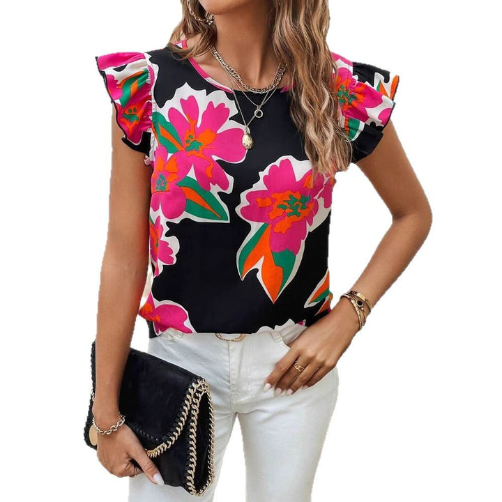 Dame blusenshirt med florale puffærmer og moderne snit Stilla