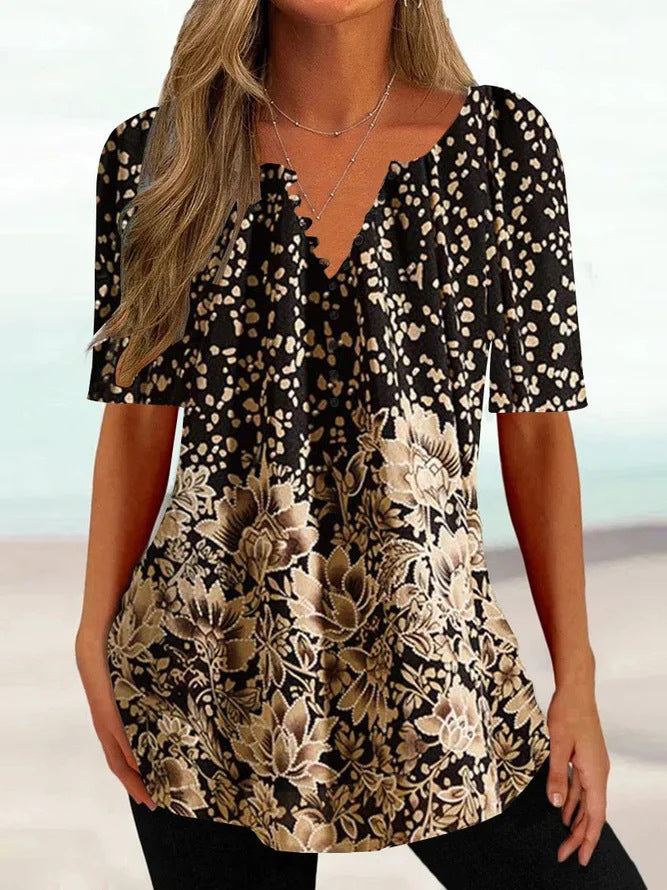 Damebluse med blomstret og elegant design Stilla