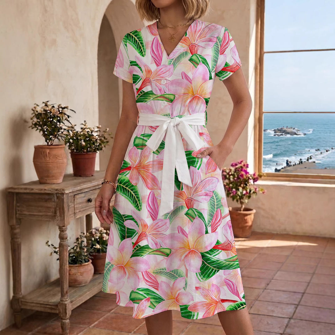 Dame midikjole med farverigt blomsterdesign og justerbart bindebælte Skovae