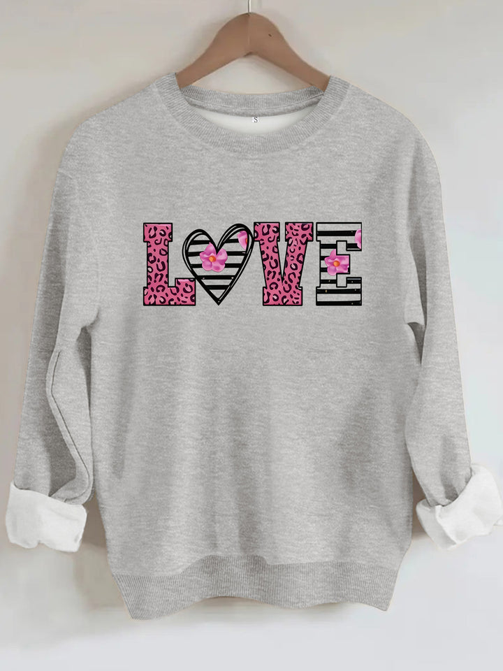 Kvinders sweatshirt med moderne leopard hjerte design og behagelig pasform Stilla