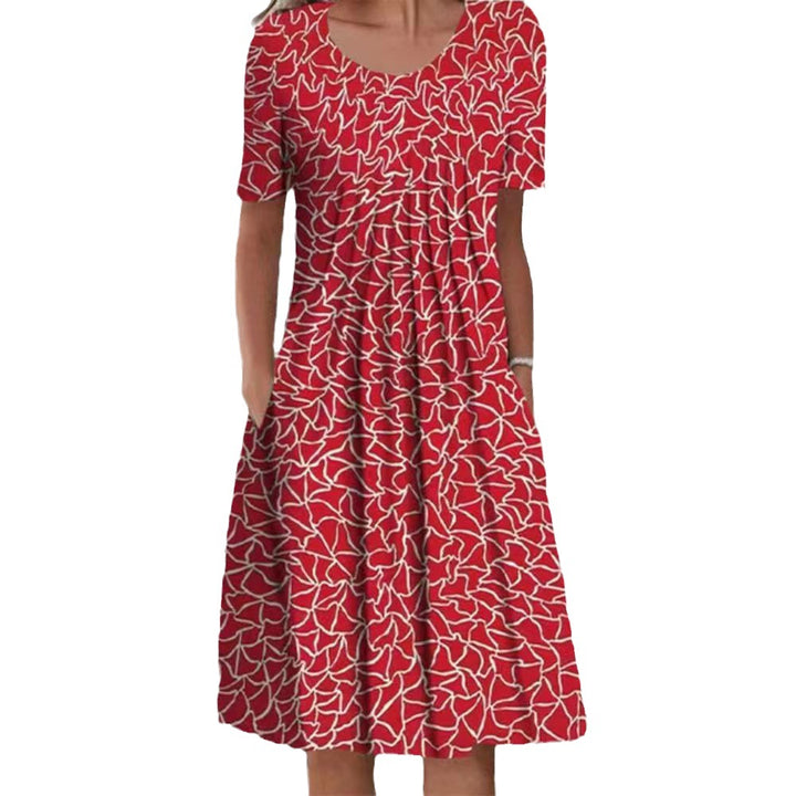 Dame fritidskjole med blomstret design og praktiske lommer Stiila