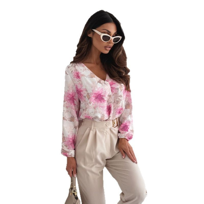 Damebluse med blomsterprint og elegante pufærmer Stilla