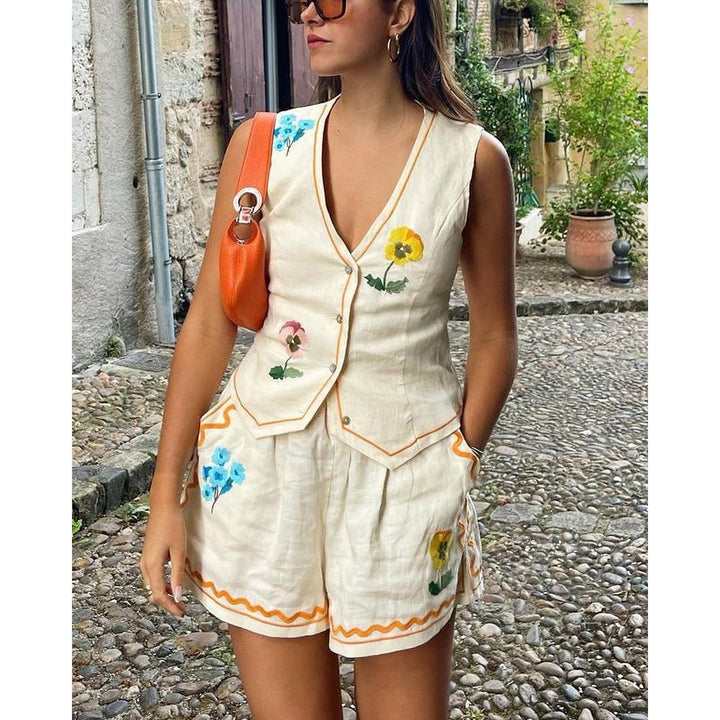 Dame Jumpsuit med blomsterbuksedragt og dekorative knapdetaljer Stilla