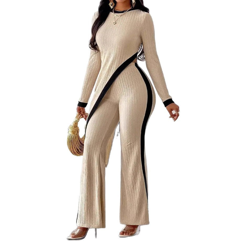 Kvinders stilfulde jumpsuit med asymmetrisk design og kontrasterende piping Stilla