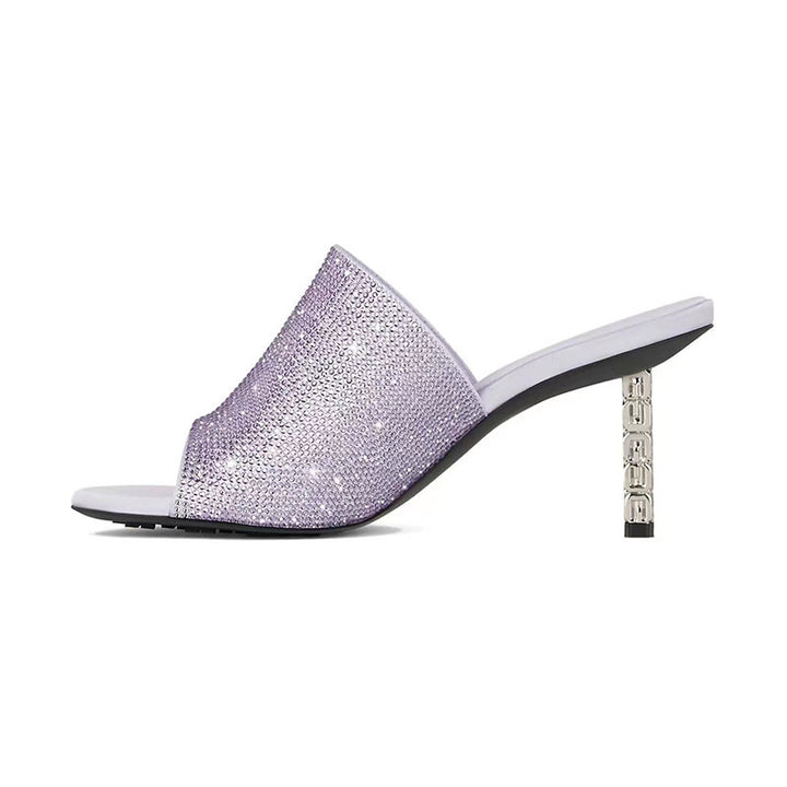 Femme Krystalbesatte Open-Toe Mules med skulpturel hæl Stilla