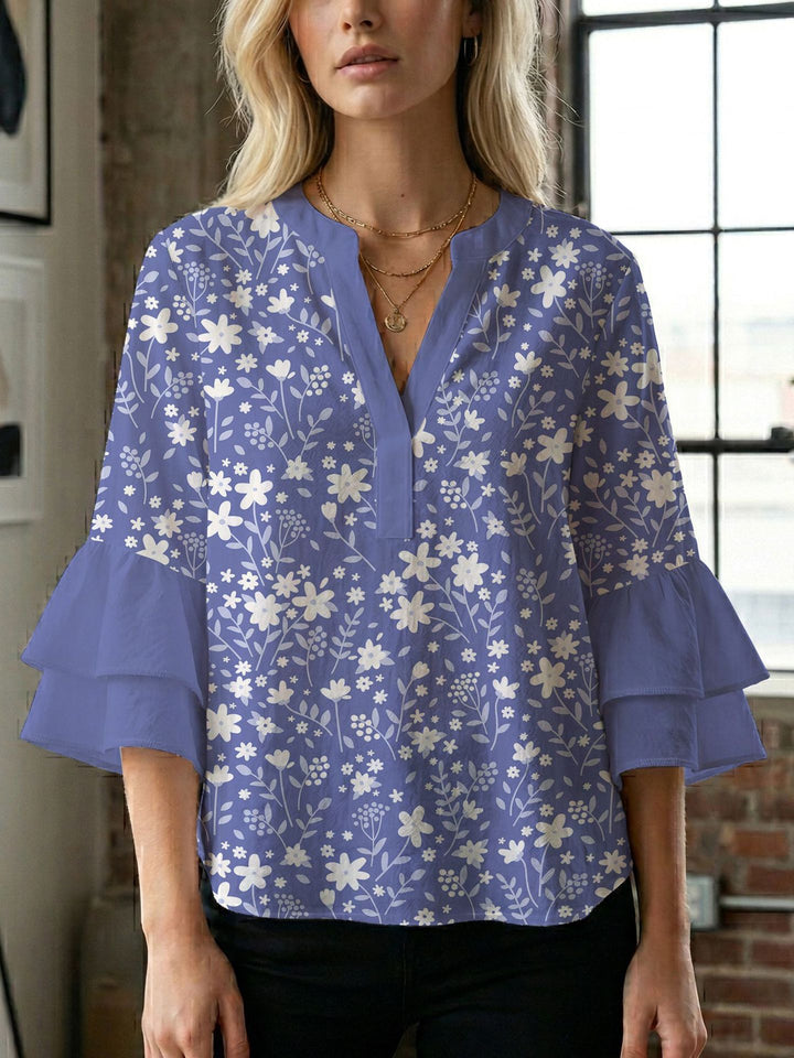 Dame bluse med voluminøse ærmer og kreativt trykdesign Skovae