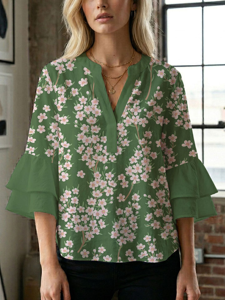 Dame bluse med voluminøse ærmer og kreativt trykdesign Skovae