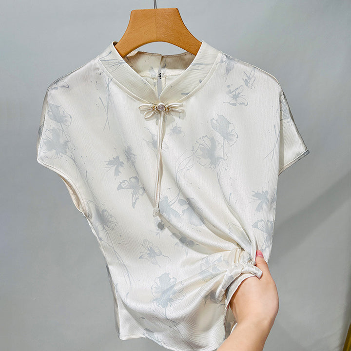 Damebluse med blomsterdesign og raffineret rynkeelement Stilla