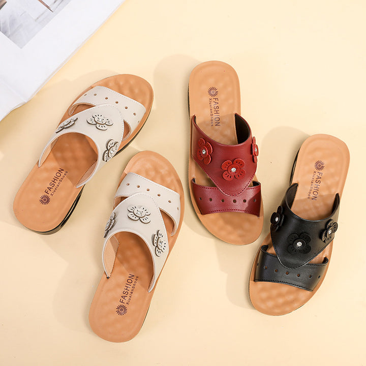 Femme dekorative Slide Sandaler med florale accenter Stilla