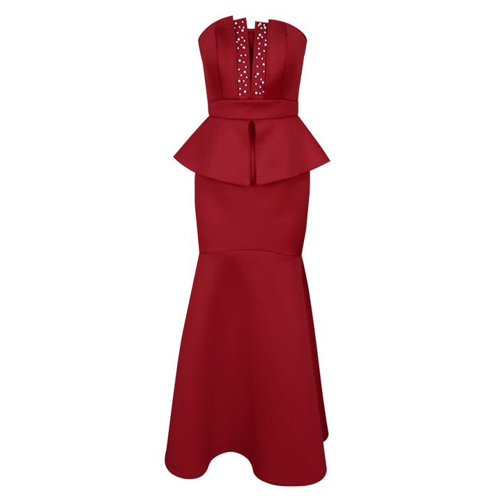 Dame aftenkjole med skinnende detaljer og voluminøs peplum drape