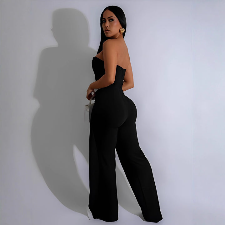Dame-jumpsuit med elegant bustier-overdel og kontrasterende kantdetaljer Skovae